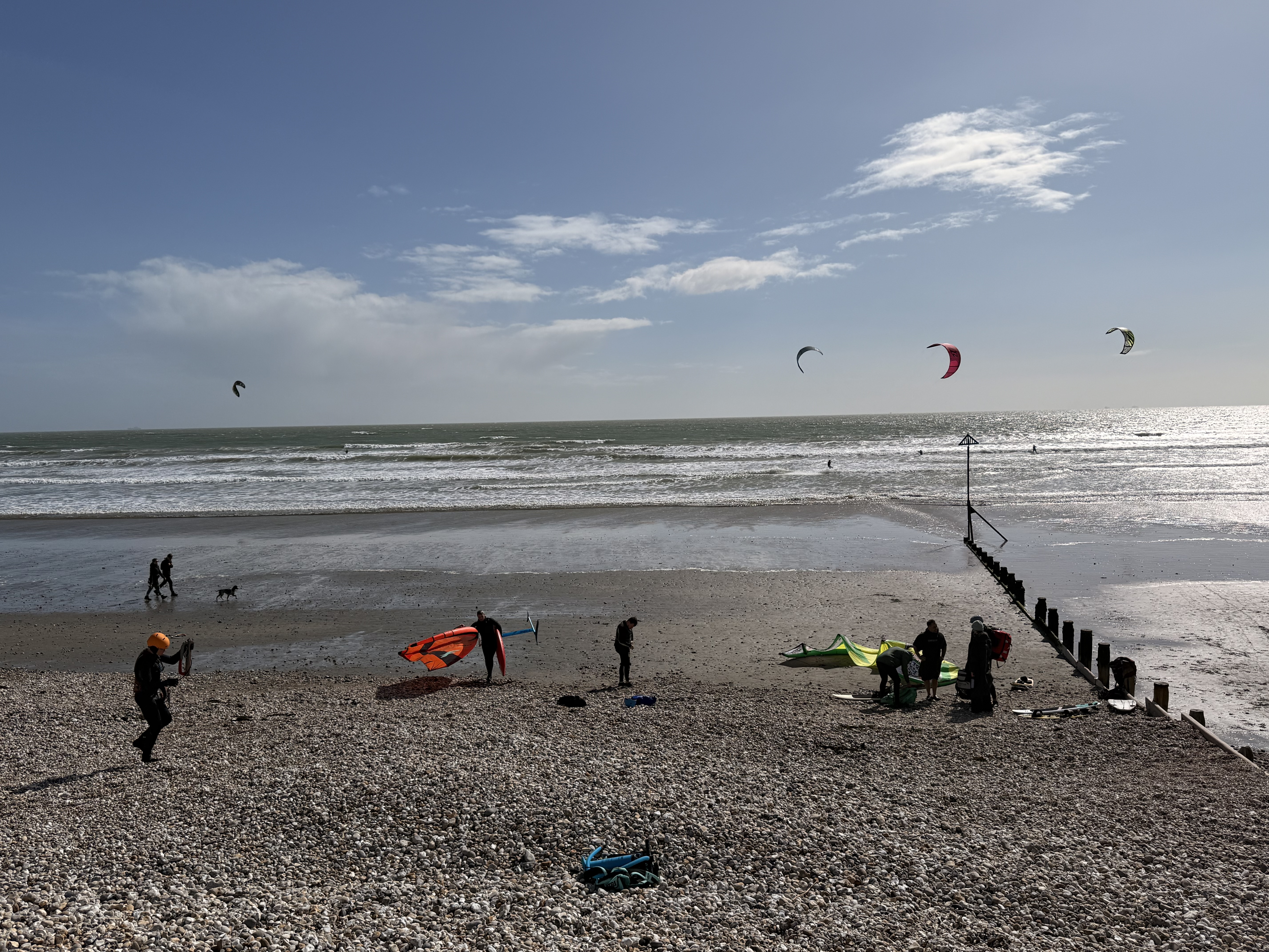 Kite surfers on East Wittering beach in April sunshine